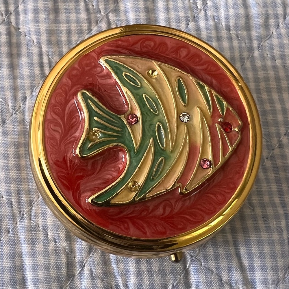 Angel type colored fish pill compact. 2” diameter